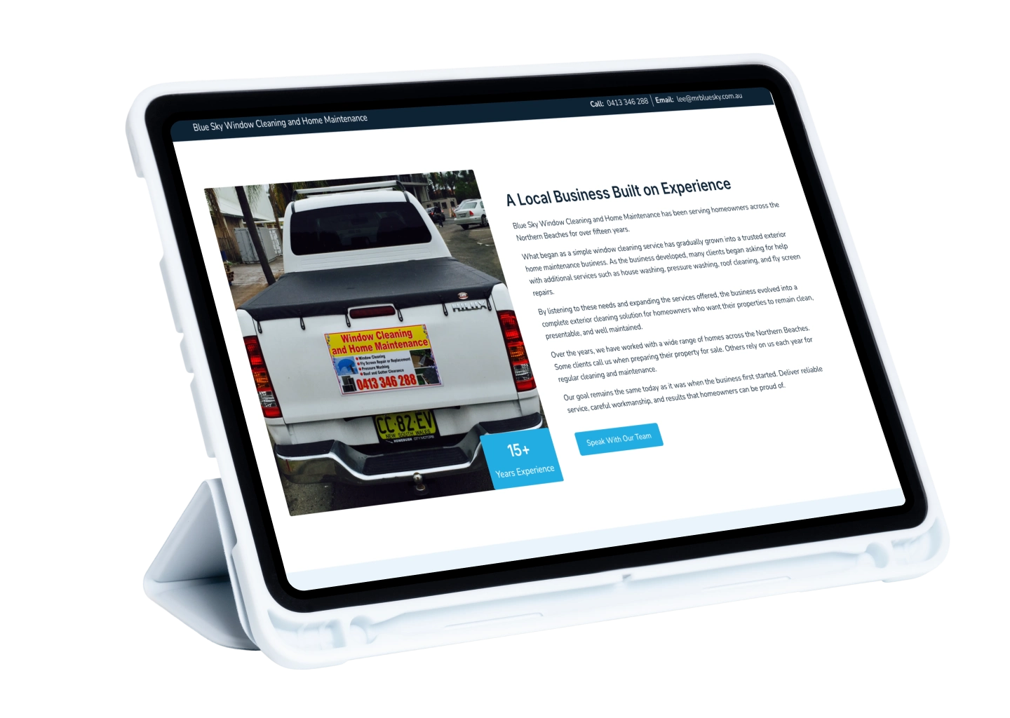 Tablet displaying a window cleaning service webpage with a photo of a white pickup truck wearing a sign and a blue '15+ Years Experience' badge next to article text about the company A Local Business Built on Experience. (informational)